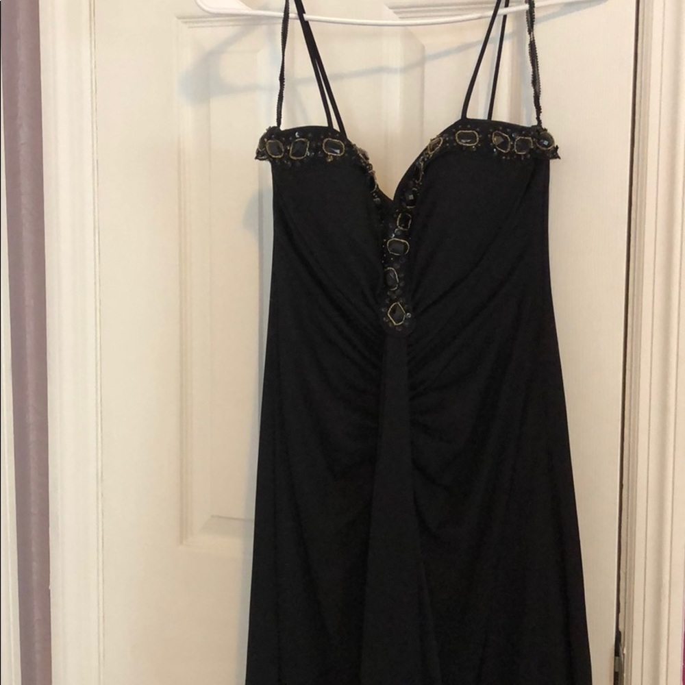 Black evening dress with gold stones.